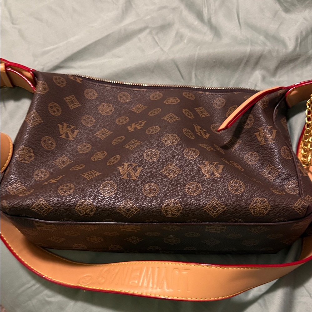 Elegant Brown Monogram Shoulder Bag with Red Accents